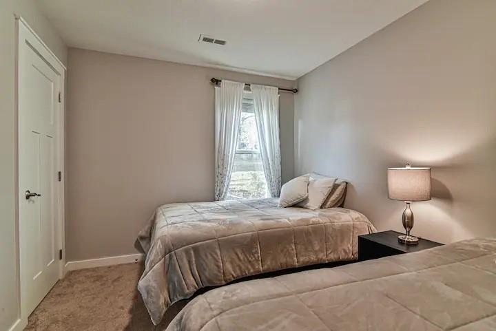 664 Old Fort Road Fairview, NC 28730 - Photo 16 of 20 a bedroom with a bed and a window
