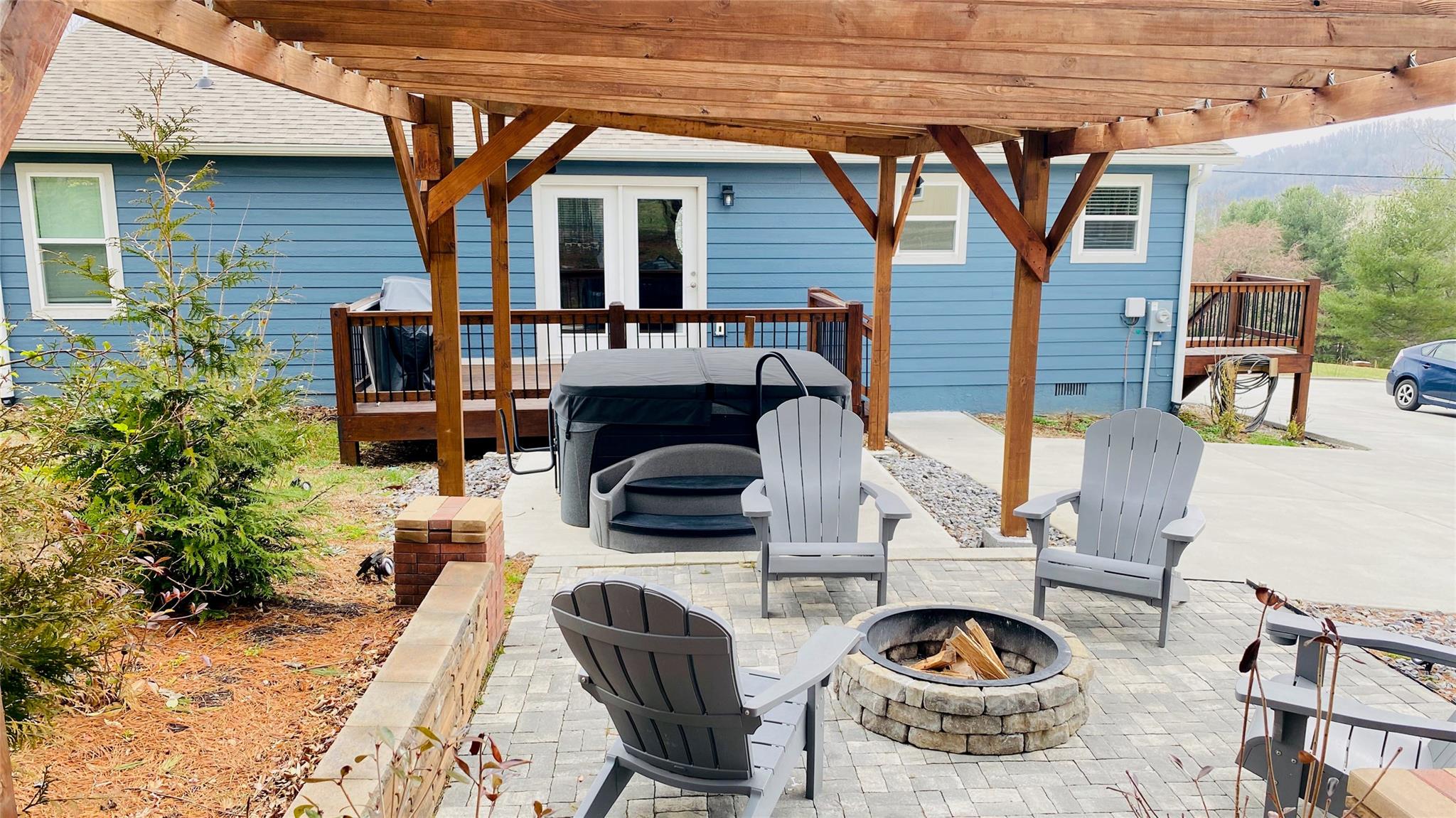 664 Old Fort Road Fairview, NC 28730 - Photo 18 of 20 a view of a patio with couches chairs and potted plants