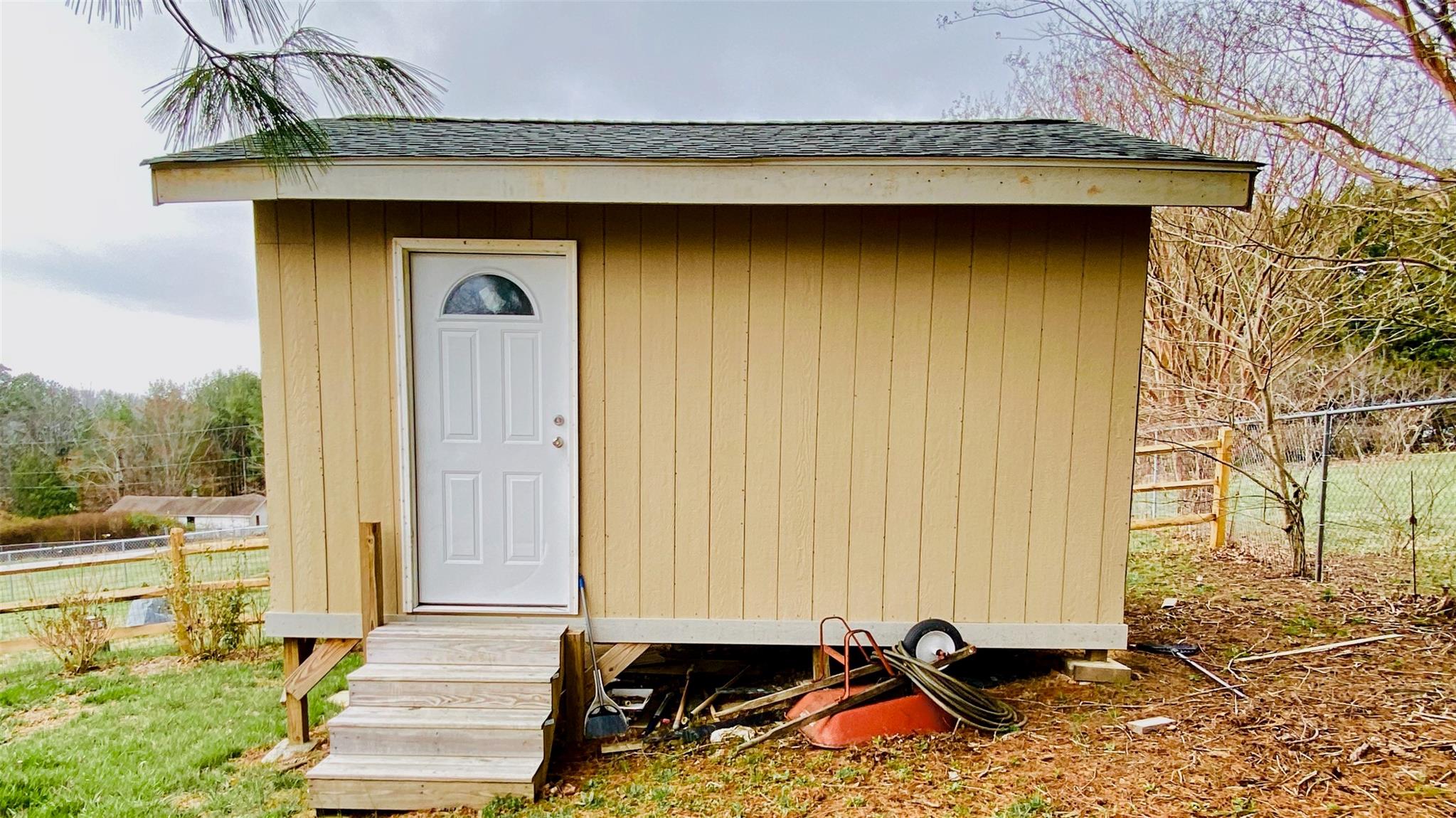 664 Old Fort Road Fairview, NC 28730 - Photo 19 of 20 a front view of a house with a garden