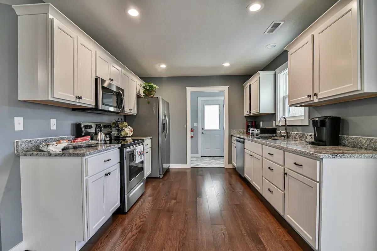 664 Old Fort Road Fairview, NC 28730 - Photo 9 of 20 a kitchen with stainless steel appliances granite countertop lots of counter top space a refrigerator a stove a sink and a cabinets