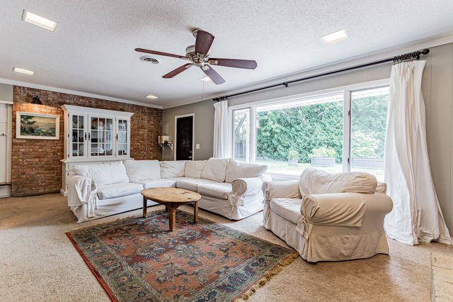 1904 Robert Drive Champaign, IL 61821 - Photo 12 of 131 a living room with furniture and a large window