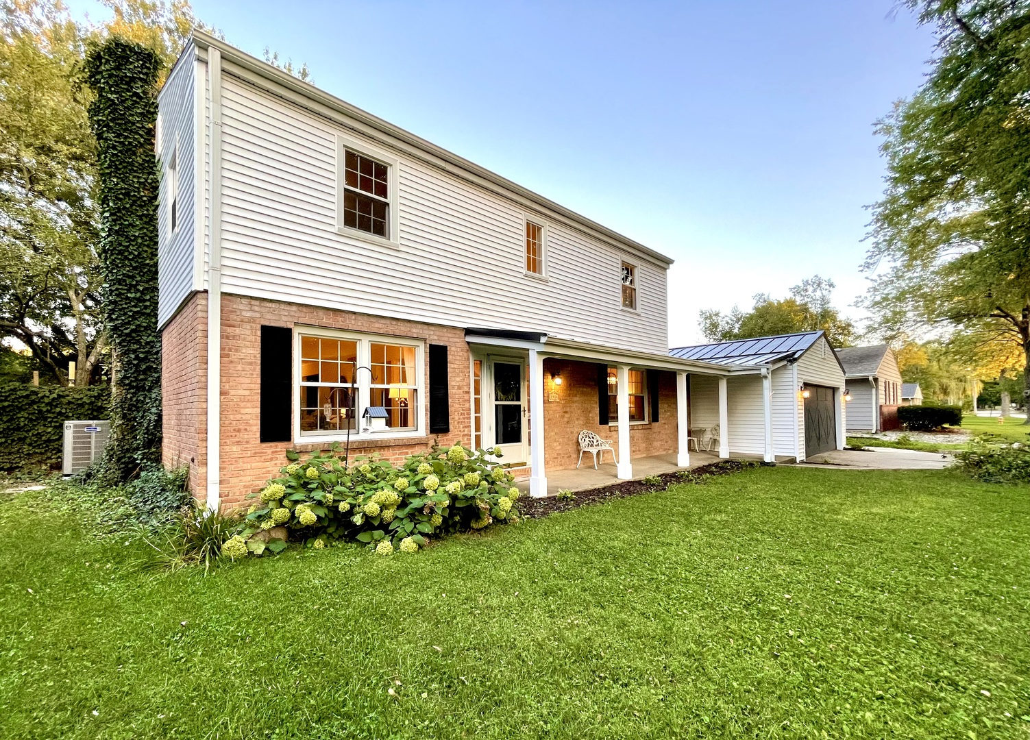 1904 Robert Drive Champaign, IL 61821 - Photo 126 of 131 a front view of a house with a garden