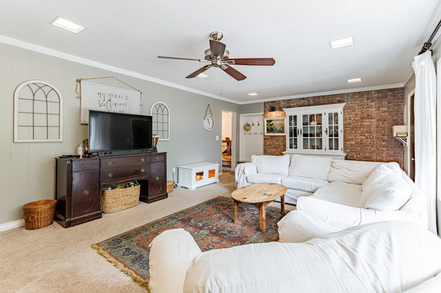 1904 Robert Drive Champaign, IL 61821 - Photo 13 of 131 a living room with furniture a flat screen tv and a large window
