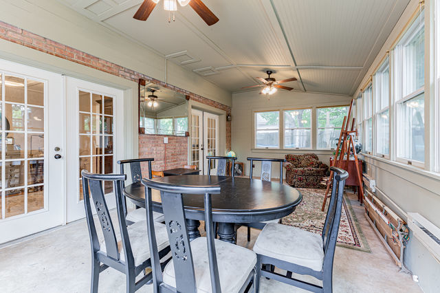 1904 Robert Drive Champaign, IL 61821 - Photo 15 of 131 a dining room with furniture a chandelier and wooden floor