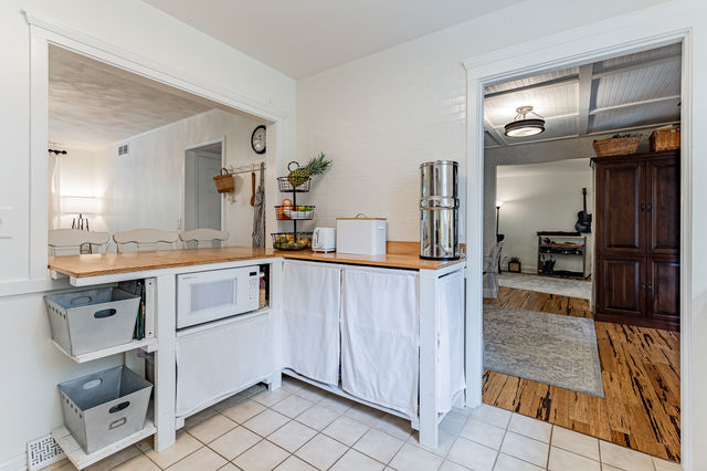 1904 Robert Drive Champaign, IL 61821 - Photo 20 of 131 a kitchen with granite countertop a refrigerator and a sink