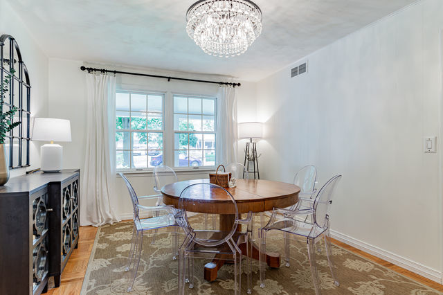 1904 Robert Drive Champaign, IL 61821 - Photo 24 of 131 a view of a dining room with furniture and wooden floor