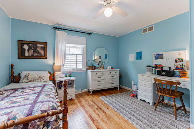 1904 Robert Drive Champaign, IL 61821 - Photo 43 of 131 a bedroom with furniture and a wooden floor