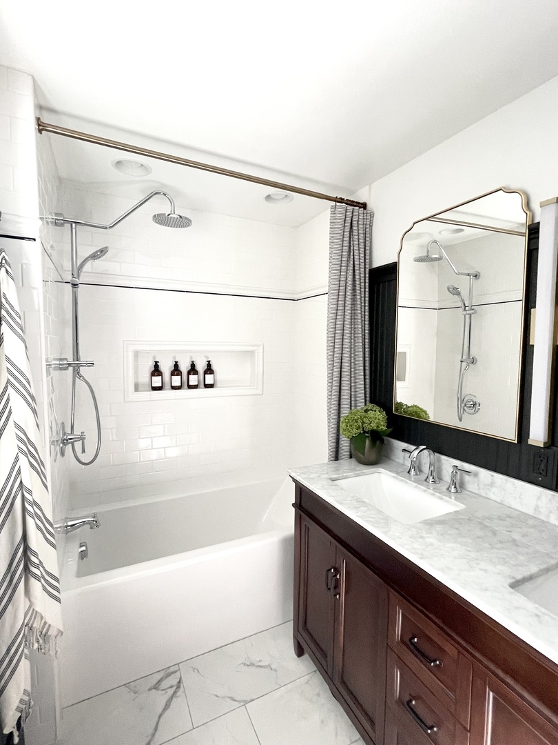 1904 Robert Drive Champaign, IL 61821 - Photo 45 of 131 a bathroom with a granite countertop bathtub sink vanity and mirror