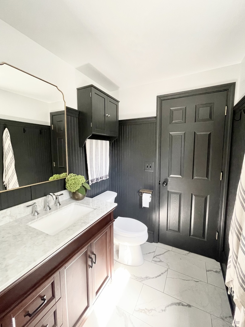1904 Robert Drive Champaign, IL 61821 - Photo 48 of 131 a bathroom with a sink double vanity and a mirror