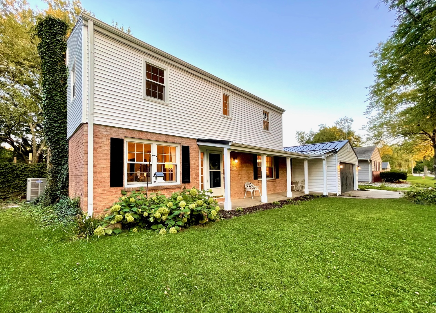 1904 Robert Drive Champaign, IL 61821 - Photo 58 of 131 a front view of a house with a garden