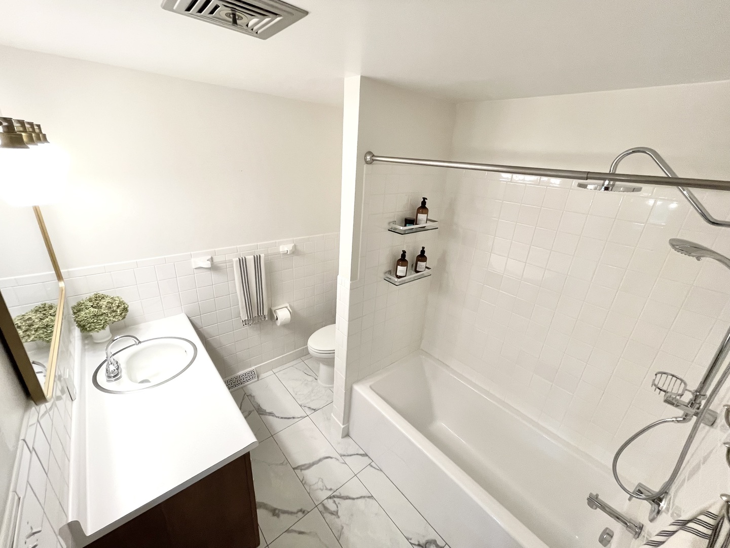 1904 Robert Drive Champaign, IL 61821 - Photo 76 of 131 a bathroom with a granite countertop sink a mirror and bathtub