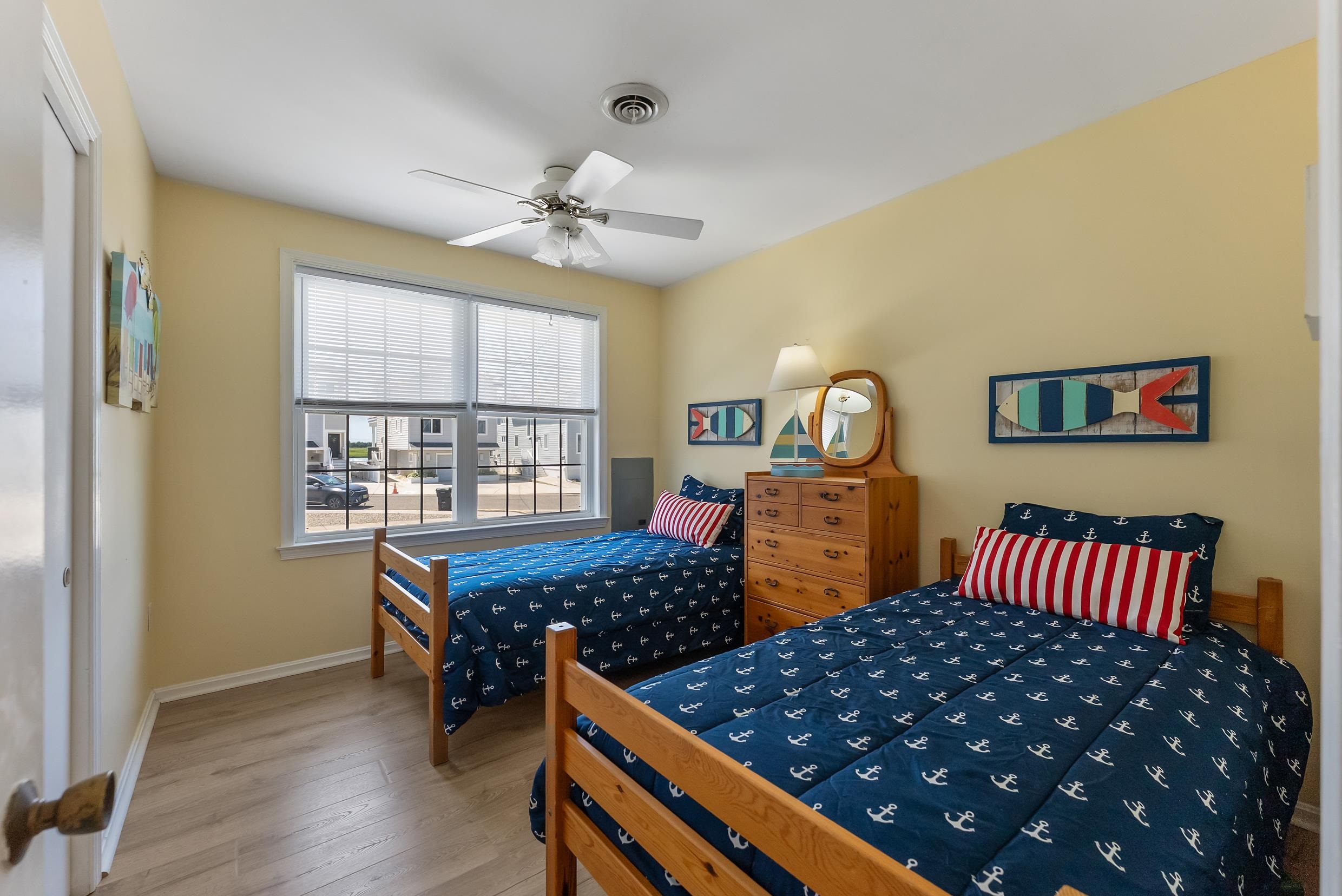 647 Barry Road Avalon, NJ 08202 - Photo 16 of 25 a bedroom with bed and wooden floor