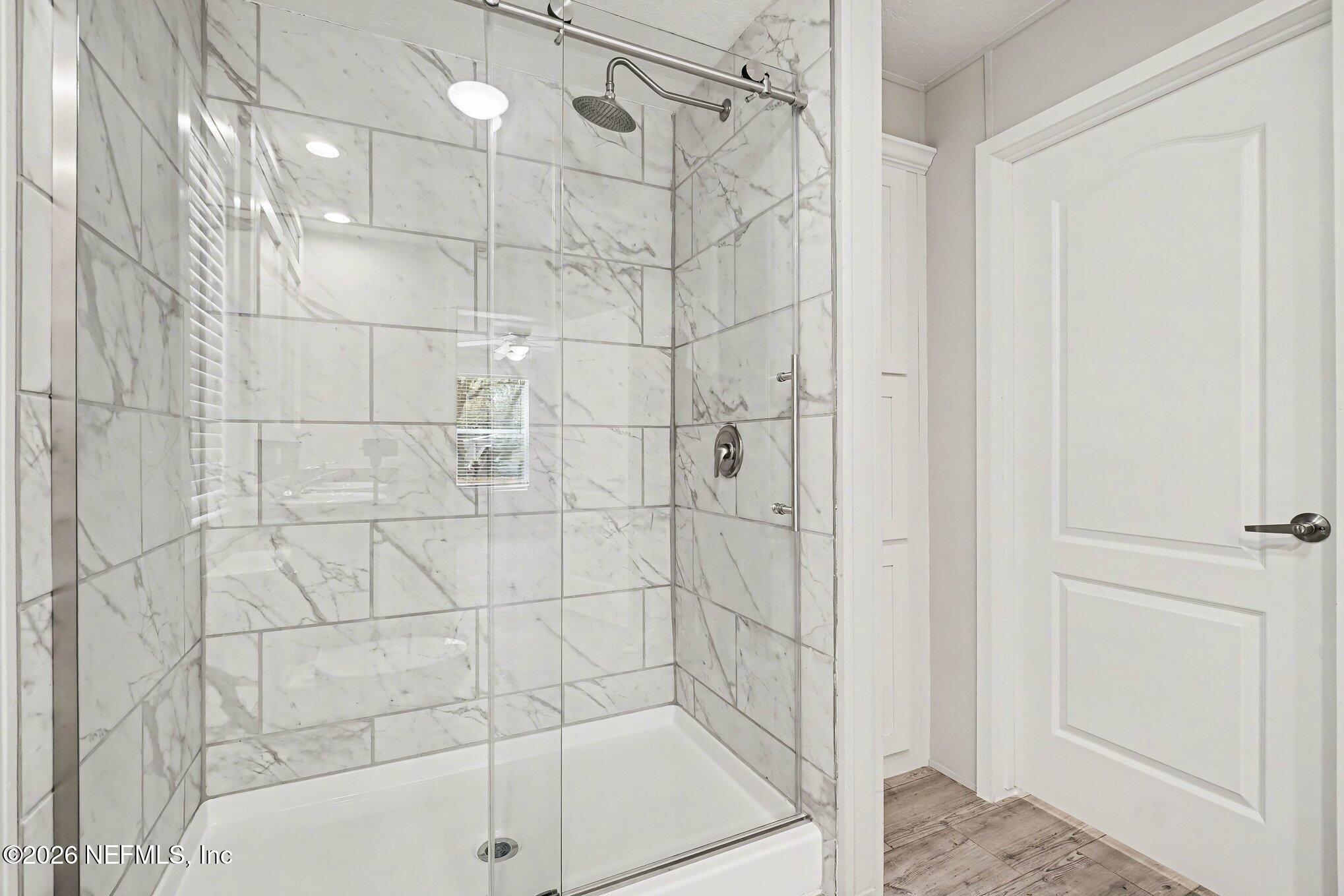 85083 Condor Lane Yulee, FL 32097 - Photo 13 of 32 a bathroom with a shower