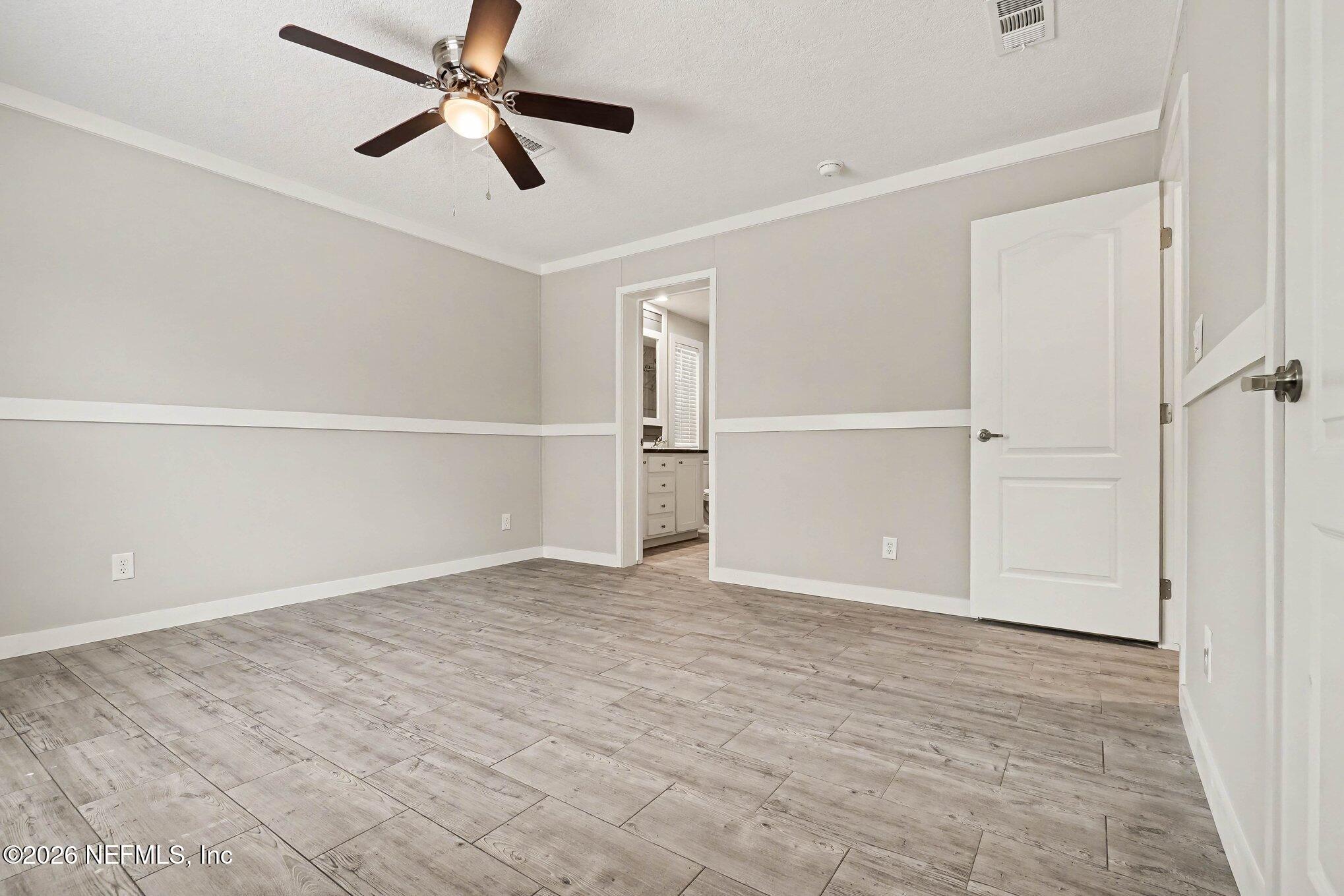85083 Condor Lane Yulee, FL 32097 - Photo 14 of 32 a view of an empty room with a window