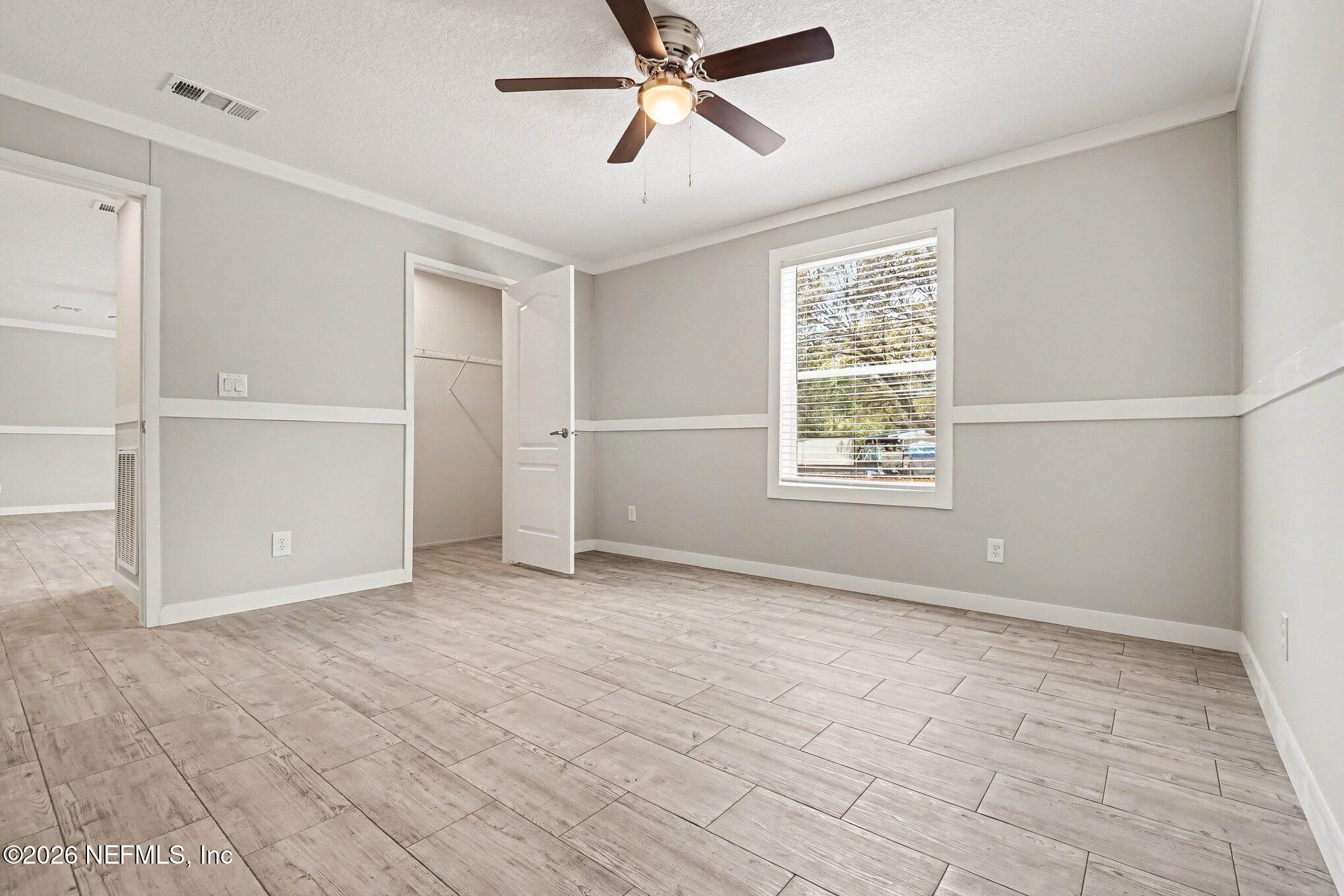 85083 Condor Lane Yulee, FL 32097 - Photo 19 of 32 a view of an empty room with a window