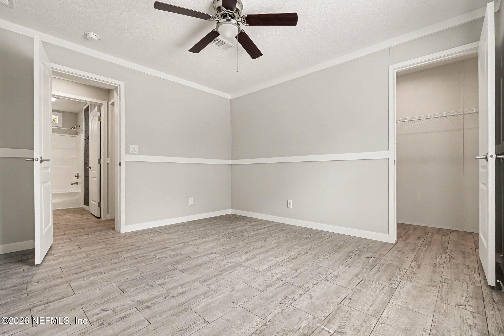 85083 Condor Lane Yulee, FL 32097 - Photo 22 of 32 wooden floor in an empty room