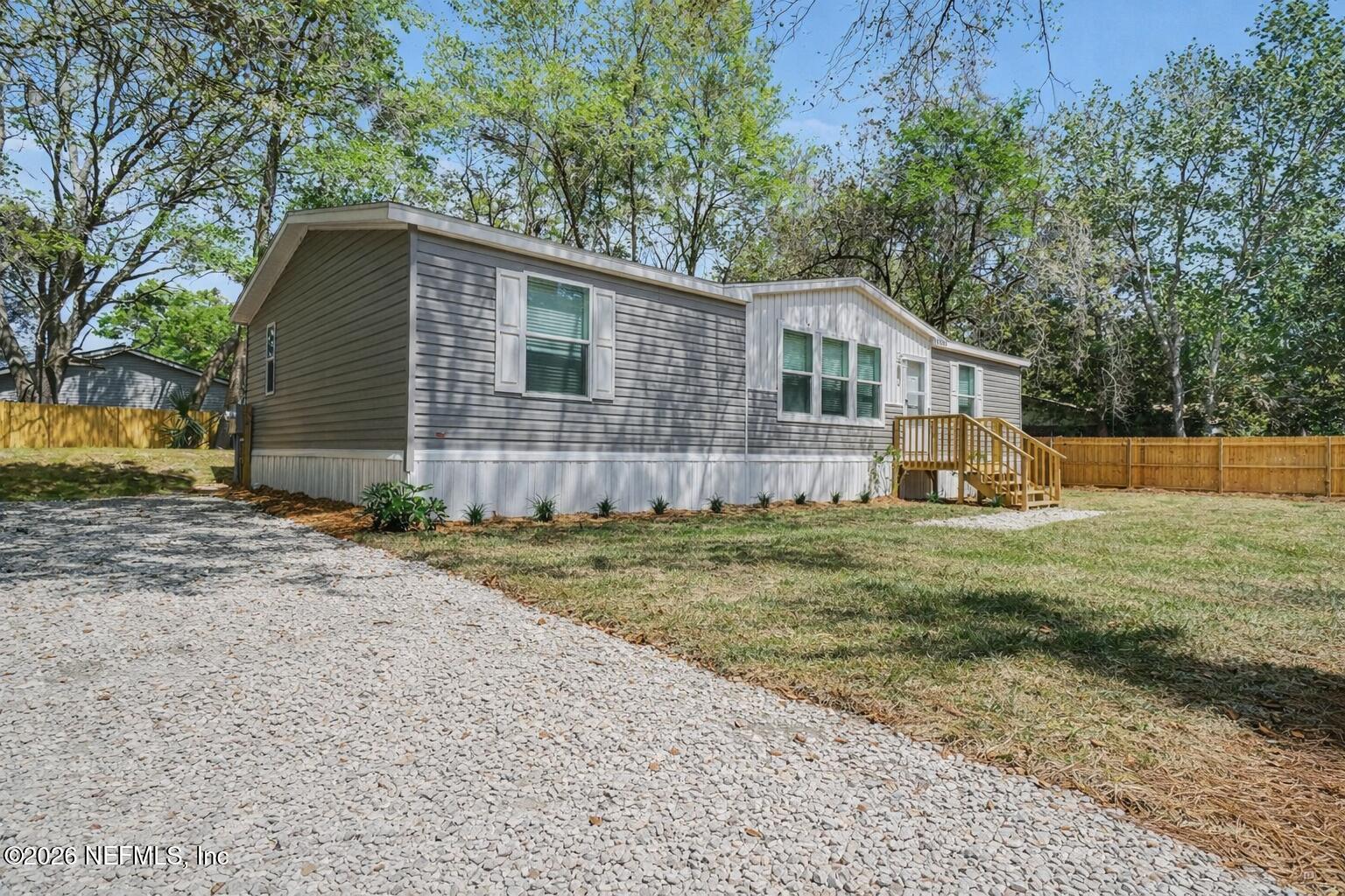 85083 Condor Lane Yulee, FL 32097 - Photo 28 of 32 a front view of a house with a yard