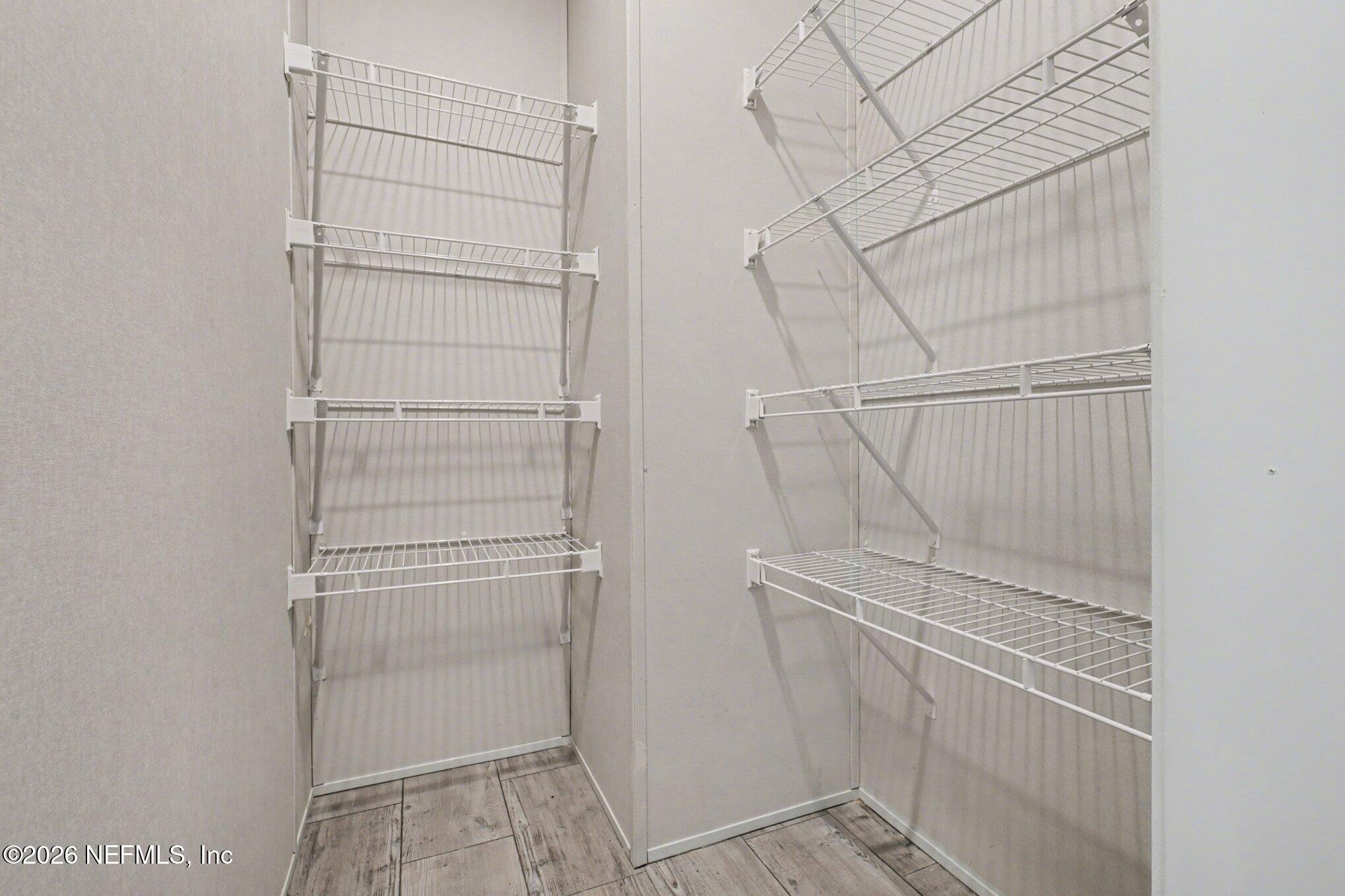 85083 Condor Lane Yulee, FL 32097 - Photo 6 of 32 a view of walk in closet with empty racks