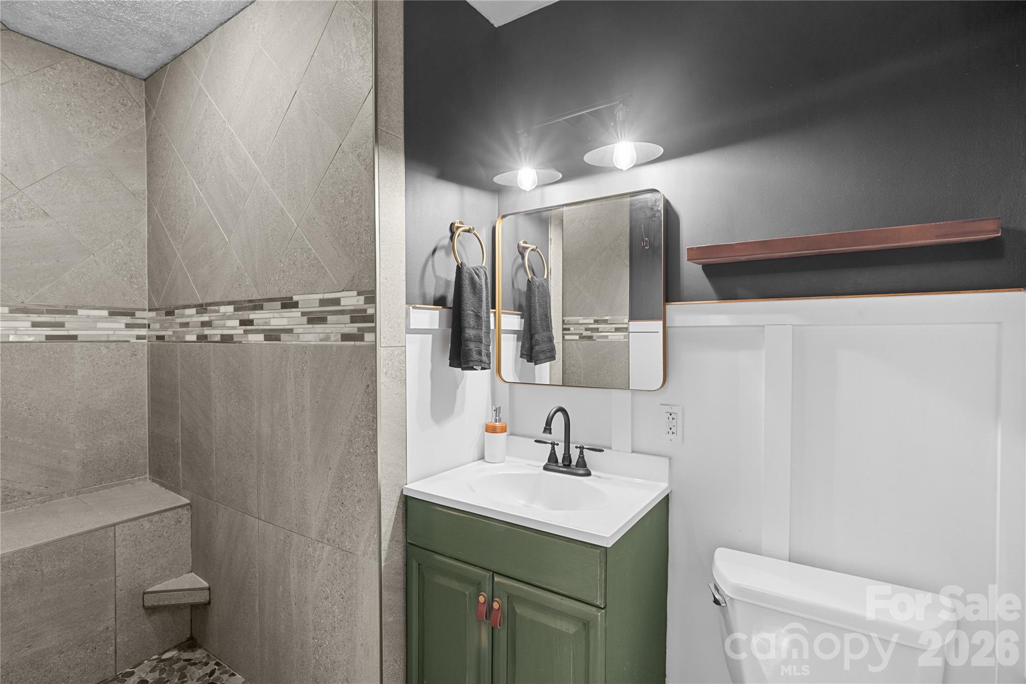 1335 Blacksnake Road Stanley, NC 28164 - Photo 24 of 31 a bathroom with a sink toilet and shower