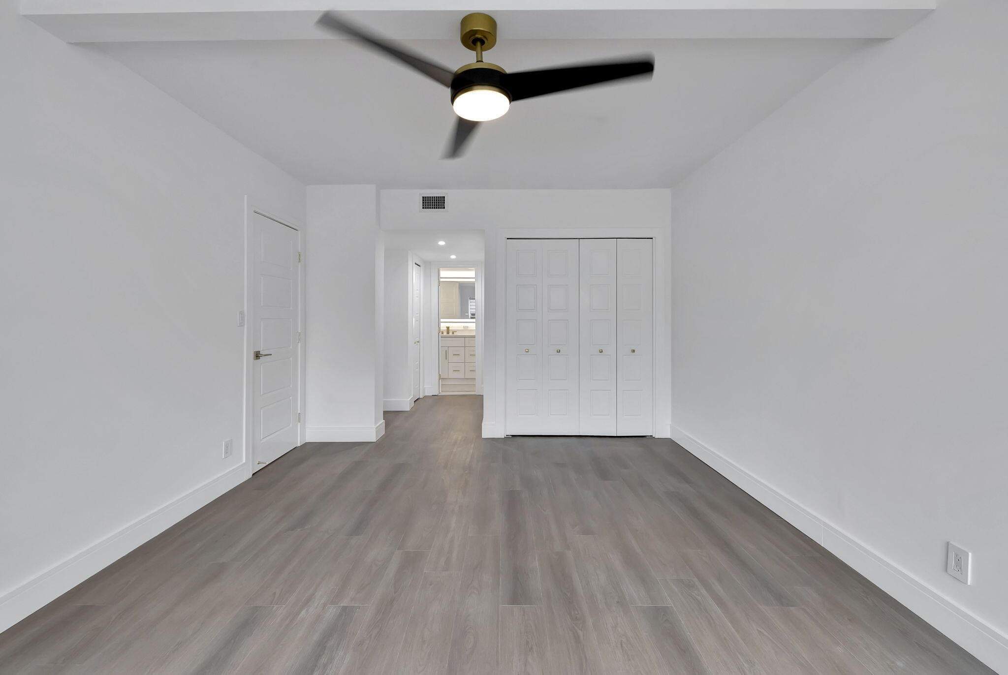 3100 North Palm Aire Drive, Unit 106 Pompano Beach, FL 33069 - Photo 17 of 42 wooden floor in an empty room