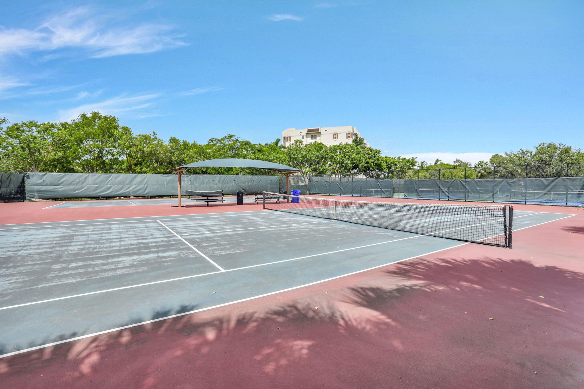 3100 North Palm Aire Drive, Unit 106 Pompano Beach, FL 33069 - Photo 31 of 42 a view of a tennis court