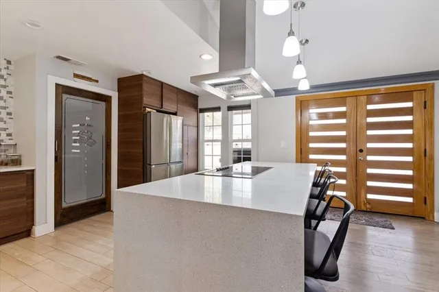 a view of kitchen and dining room with wooden floor