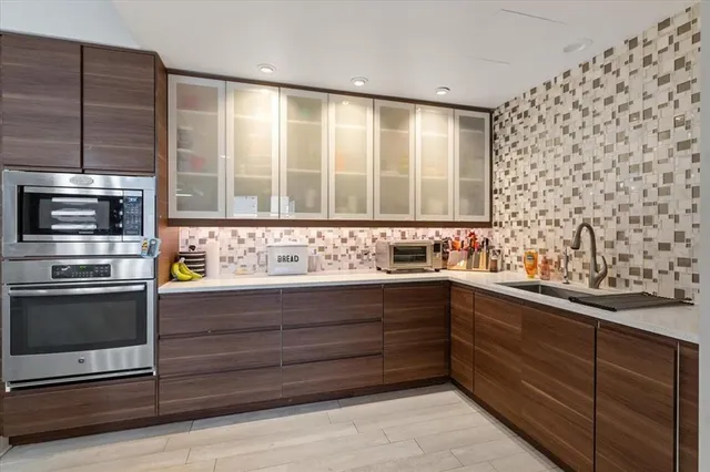 a bathroom with a sink and a large mirror