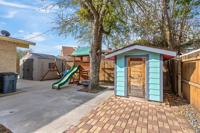 a view of outdoor space with sliding door and wooden deck