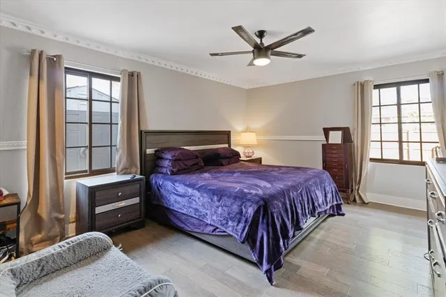 a bedroom with a bed and window