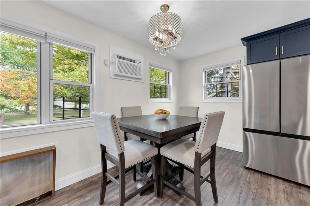 349 Bay 8th Street, Unit 2B Brooklyn, NY 11228 - Photo 3 of 11 a view of a dining room with furniture window and wooden floor