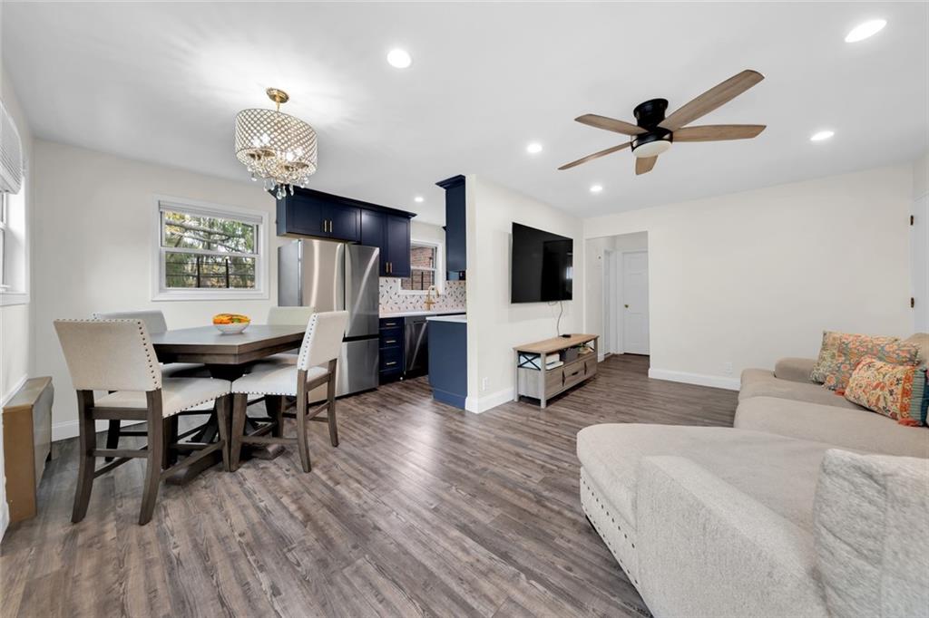 349 Bay 8th Street, Unit 2B Brooklyn, NY 11228 - Photo 4 of 11 a living room with furniture and wooden floor