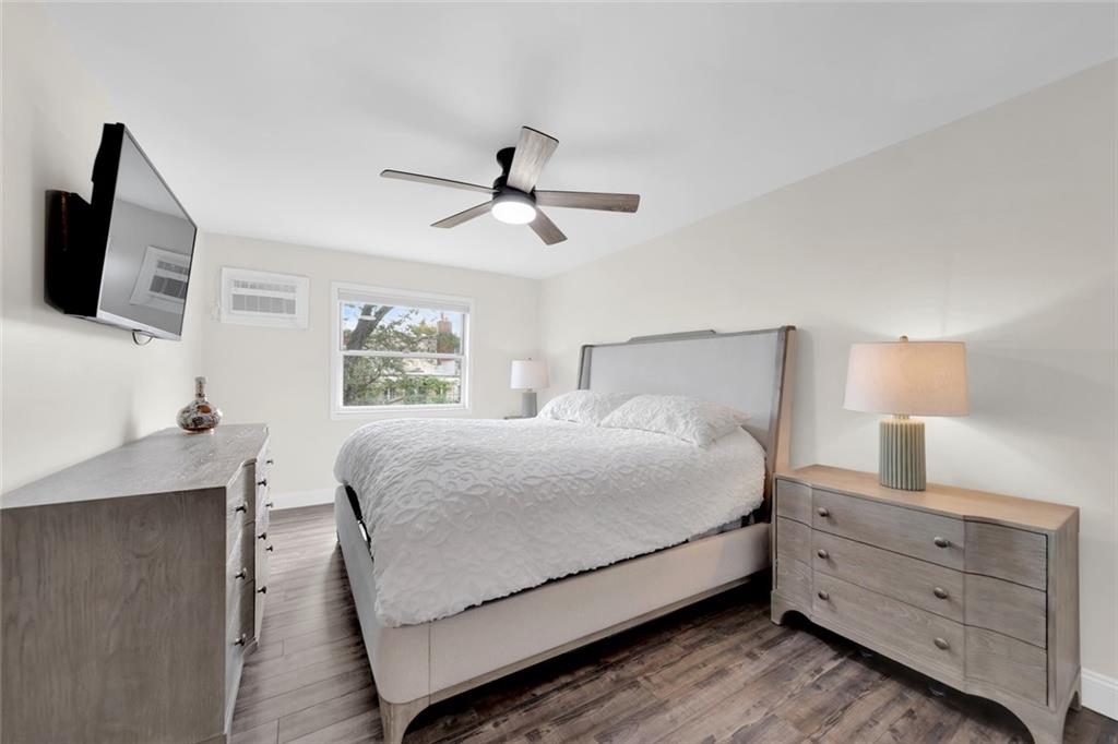 349 Bay 8th Street, Unit 2B Brooklyn, NY 11228 - Photo 6 of 11 a large bed sitting in a bedroom and tv on a dresser