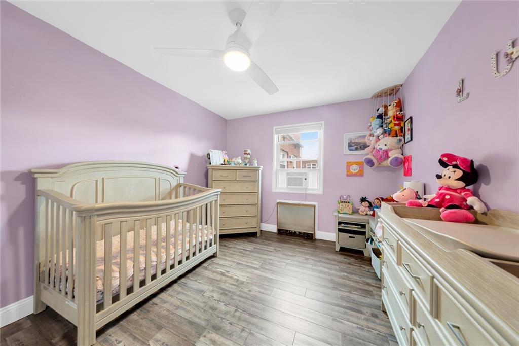 349 Bay 8th Street, Unit 2B Brooklyn, NY 11228 - Photo 7 of 11 a bedroom with furniture and a window