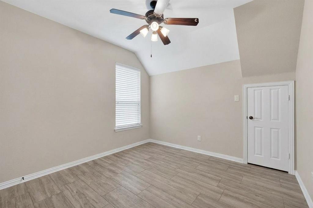 7625 Ridgedale Court Sachse, TX 75048 - Photo 20 of 40 wooden floor in an empty room with a window