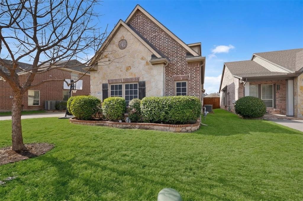 7625 Ridgedale Court Sachse, TX 75048 - Photo 2 of 40 a front view of a house with a yard