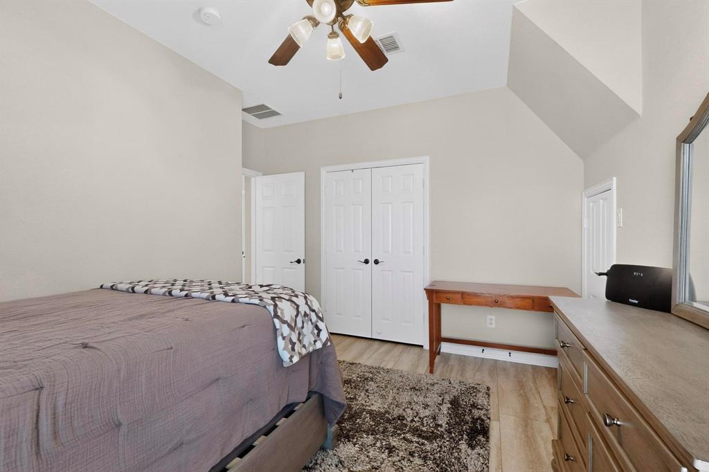 7625 Ridgedale Court Sachse, TX 75048 - Photo 28 of 40 a bedroom with a bed and a dresser