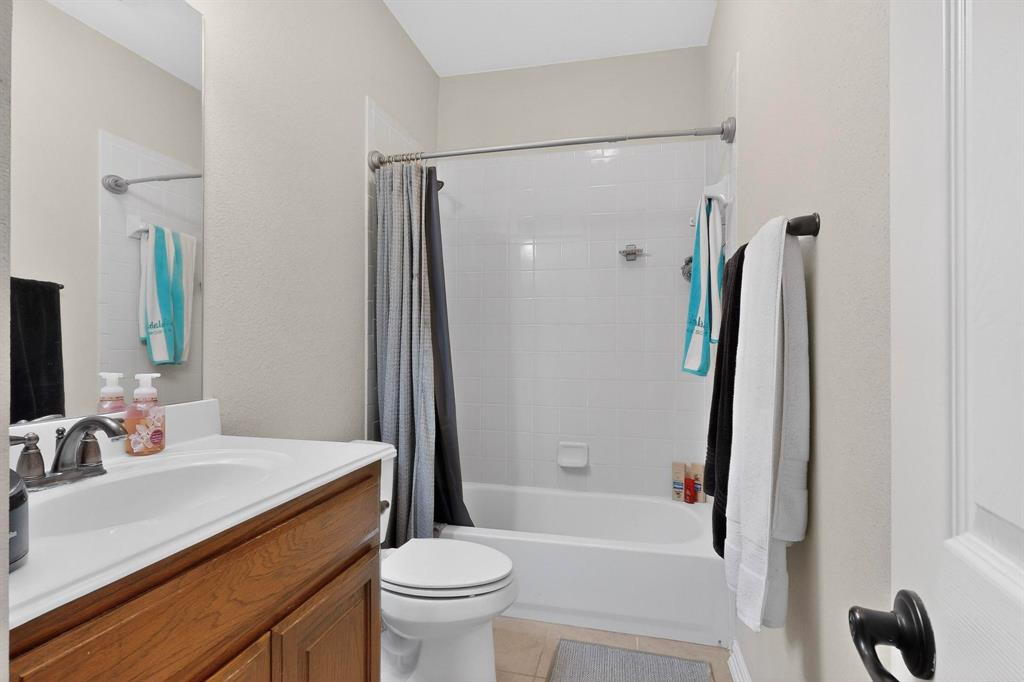 7625 Ridgedale Court Sachse, TX 75048 - Photo 29 of 40 a bathroom with a sink toilet and shower