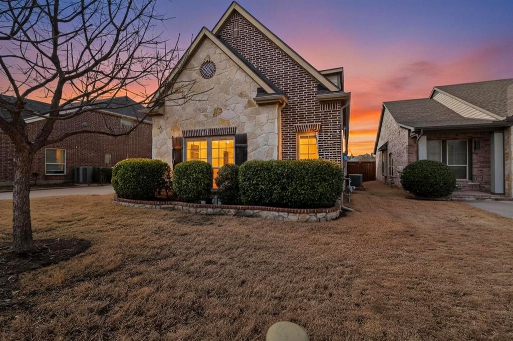 7625 Ridgedale Court Sachse, TX 75048 - Photo 3 of 40 a front view of a house with garden