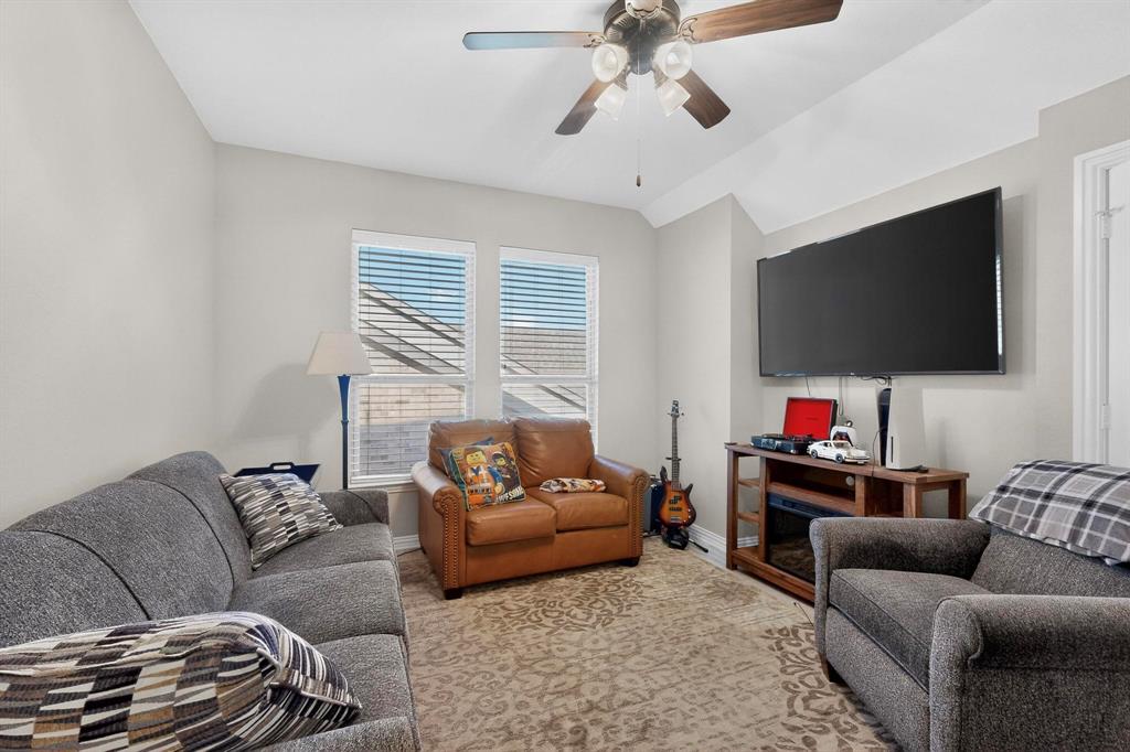 7625 Ridgedale Court Sachse, TX 75048 - Photo 31 of 40 a living room with furniture and a flat screen tv