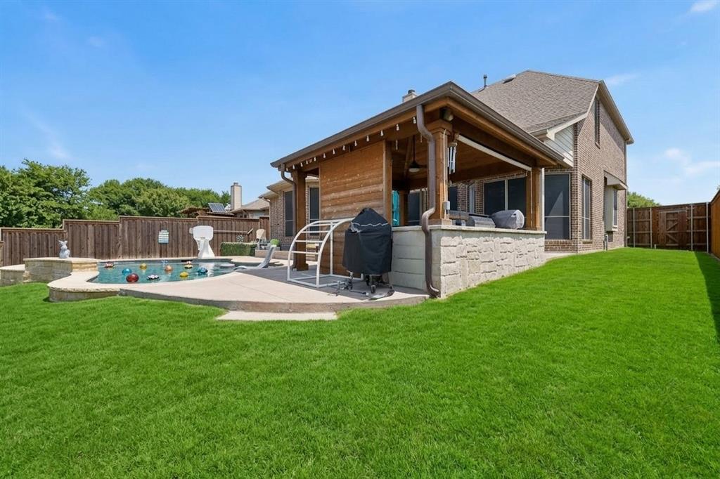 7625 Ridgedale Court Sachse, TX 75048 - Photo 39 of 40 a view of a house with a yard and furniture