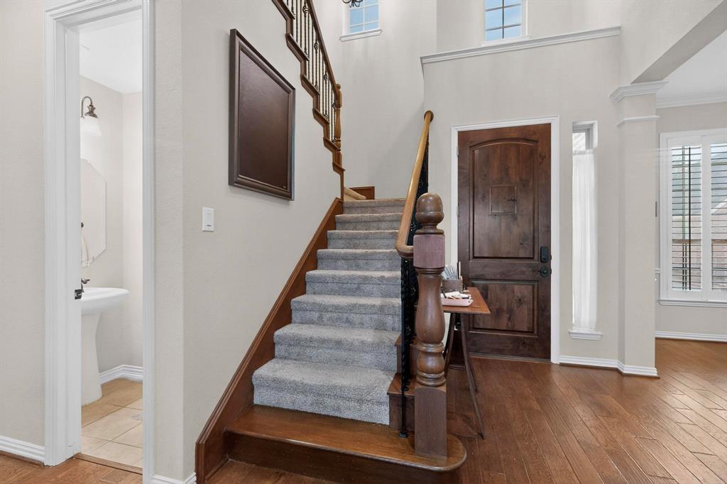 7625 Ridgedale Court Sachse, TX 75048 - Photo 4 of 40 a view of entryway and hall with wooden floor