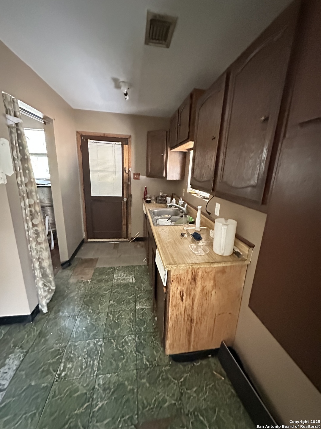 10498 Hollowell Road Atascosa, TX 78002 - Photo 11 of 11 a view of utility room and window
