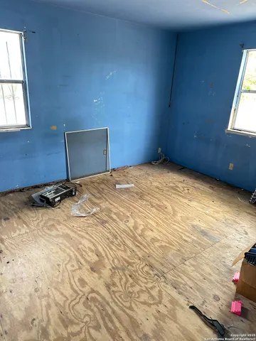 an empty room with windows