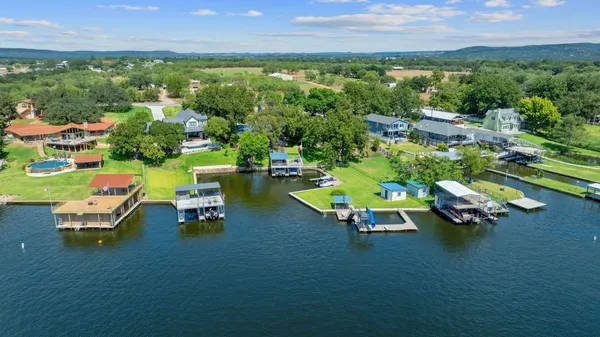 an aerial view of a house with outdoor space