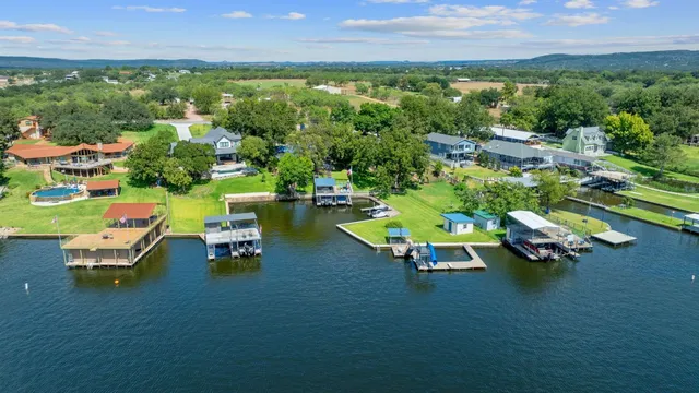 an aerial view of a house with outdoor space