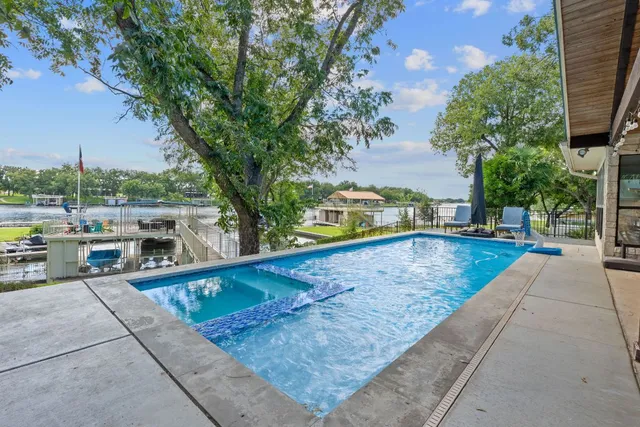 a view of a swimming pool with a lounge chairs
