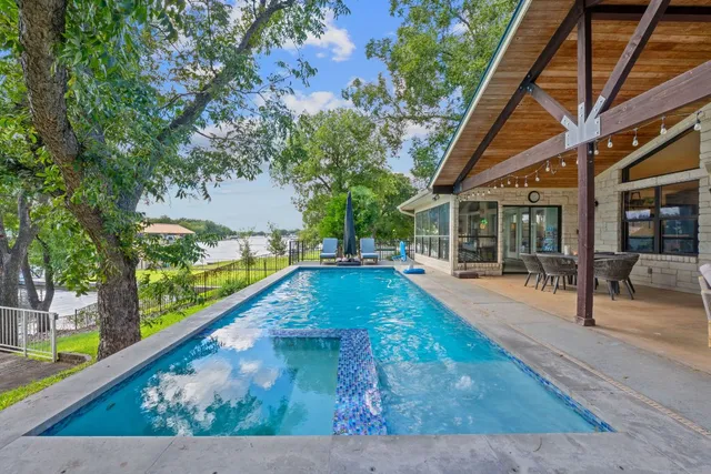 a view of swimming pool with seating space