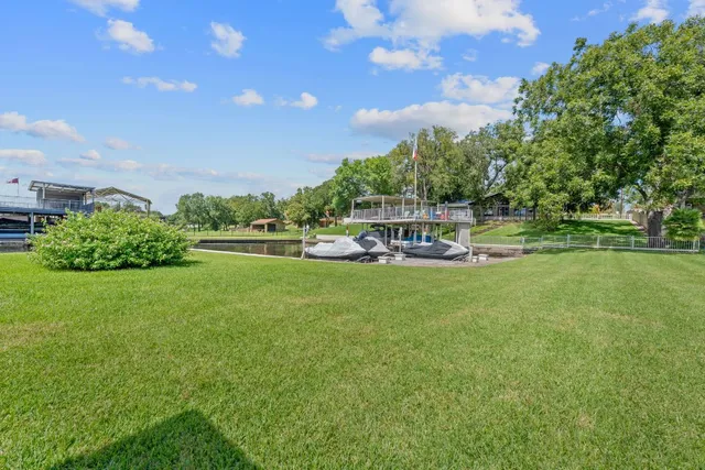 a view of a swimming pool with an outdoor seating and a garden