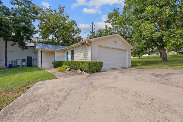 a bedroom with a bed and large window