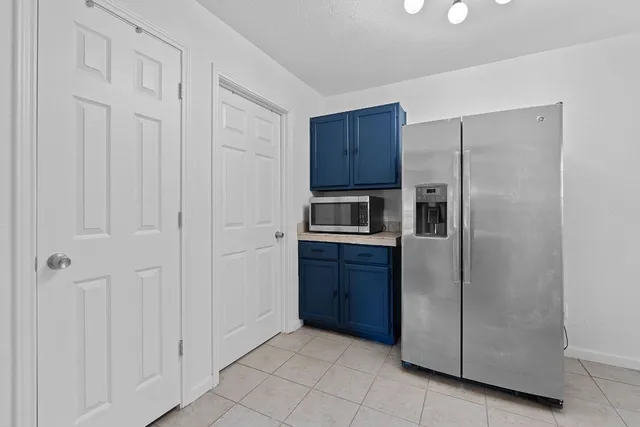 a view of backyard with a patio and plants